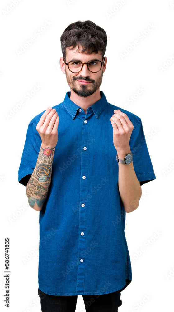 Canvas Prints Young handsome man wearing glasses over isolated background Doing money gesture with hand, asking for salary payment, millionaire business