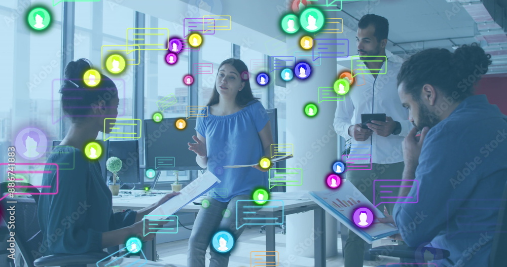 Poster image of profile and message icons over diverse colleagues discussing over a document at office