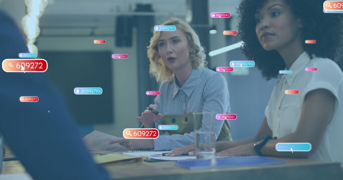 Image of social media icons over caucasian woman talking to diverse colleagues at office