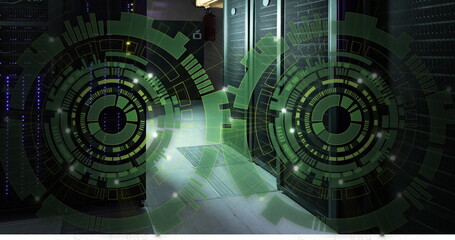 Image of two green round scanner spinning against computer server room