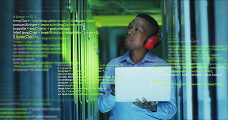 Image of data processing over african american male engineer using laptop at server room