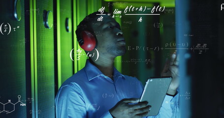 Image of equations over african american male engineer using digital tablet at server room