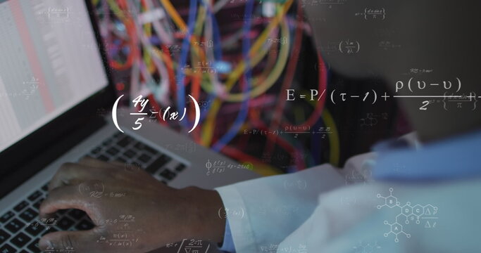 Image of mathematical equations over african american male engineer using laptop at server room