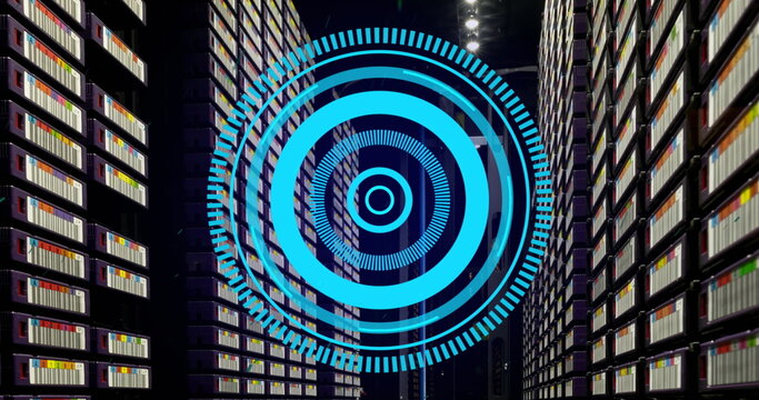 Image of blue round scanner spinning against computer server room