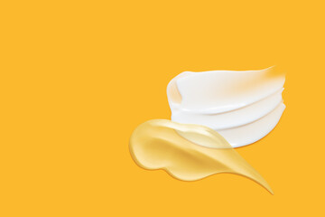 Cosmetic cream smears background. Beauty lotion creamy texture. Skincare product swatches on orange