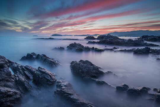 Misty sunset over a Rocky coastal seascape, Gamagori, Aichi Prefecture, Honshu, Japan