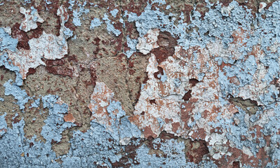 Texture of old rustic wall covered with gray and blue stucco. Multilayers of old paint on the wall....