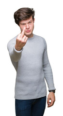 Young handsome man wearing winter sweater over isolated background Showing middle finger, impolite...