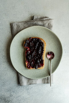 Overhead view of a slice of Toast with blueberry jam