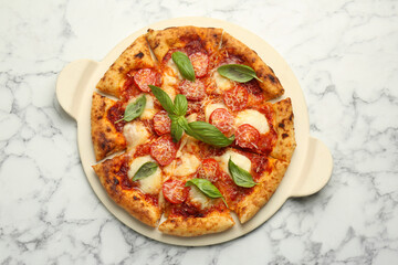 Delicious Margherita pizza on white marble table, top view