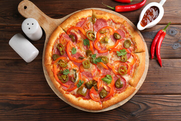 Delicious pizza Diablo served on wooden table, flat lay