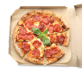 Tasty pepperoni pizza with basil in cardboard box isolated on white, top view