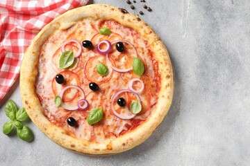 Delicious vegetarian pizza on light grey table, top view. Space for text