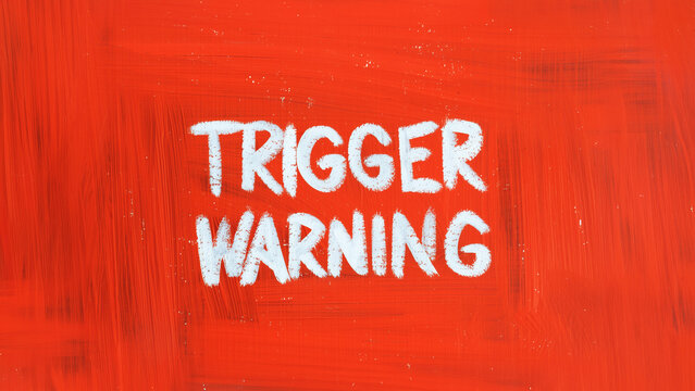 Red background trigger warning sign. Mental triggering concept.
