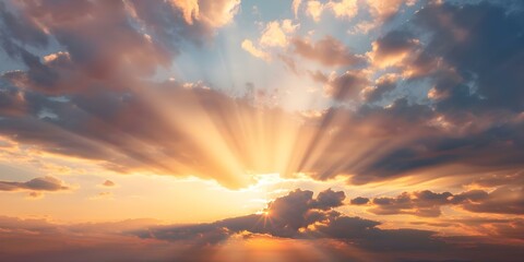 Fototapeta premium Vivid sunset with sun rays peeking through dramatic colorful clouds. Concept Sunset photography, Sun rays, Dramatic clouds, Colorful sky, Vivid colors
