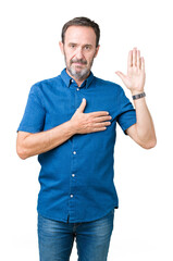 Handsome middle age elegant senior man over isolated background Swearing with hand on chest and...