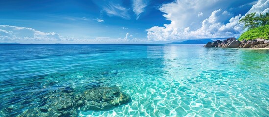 Stunning coastal view with clear turquoise waters offers a serene setting for a relaxing holiday with a magnificent copy space image.