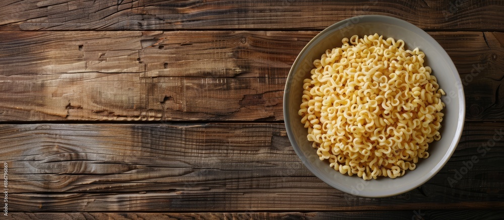Poster half a plate of instant noodles placed on a wooden table with ample copy space image.