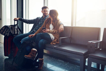 Lounge, luggage and phone with couple in airport for travel, waiting for boarding gate together....