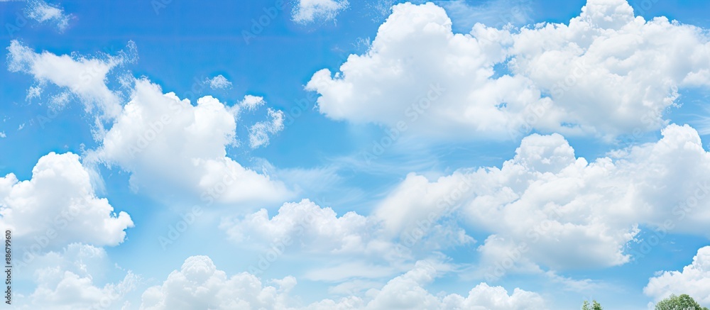 Aufkleber stock photo of a clear blue sky and fluffy clouds with copy space image.