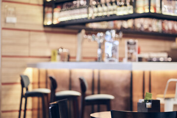 The interior design of the cafe is made in a vintage wooden style, decorated in warm and cozy tones, relaxing tones with a classic old wood counter. With space to copy. High quality photo