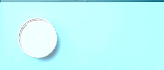  A tin of yogurt sits atop a blue table, beside a can of yogurt