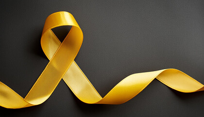 Yellow awareness ribbon on black. Symbol of support. Top view. For troops military, suicide prevention