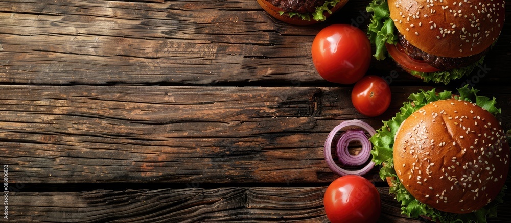 Poster close-up of homemade burgers on a rustic wooden backdrop with copy space image.