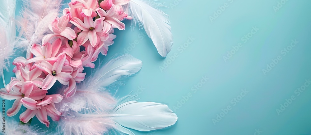 Fototapete pink hyacinth flowers with white feathers against pastel blue or cyan colors, ideal for adding your 