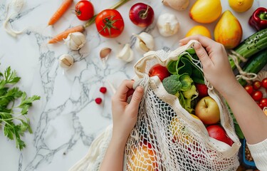 Top view of a woman's hands putting fresh vegetables and fruits into a net bag, depicting a sustainable living concept