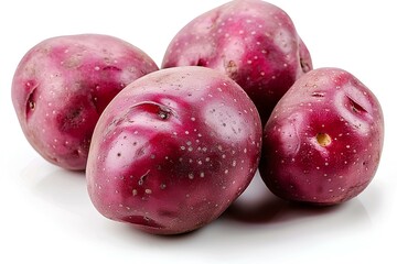 Obraz premium A group of purple potatoes sitting on top of a white surface