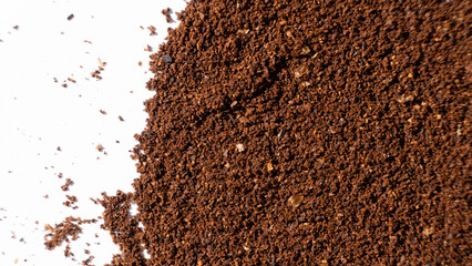 Scattered ground natural coffee on white background