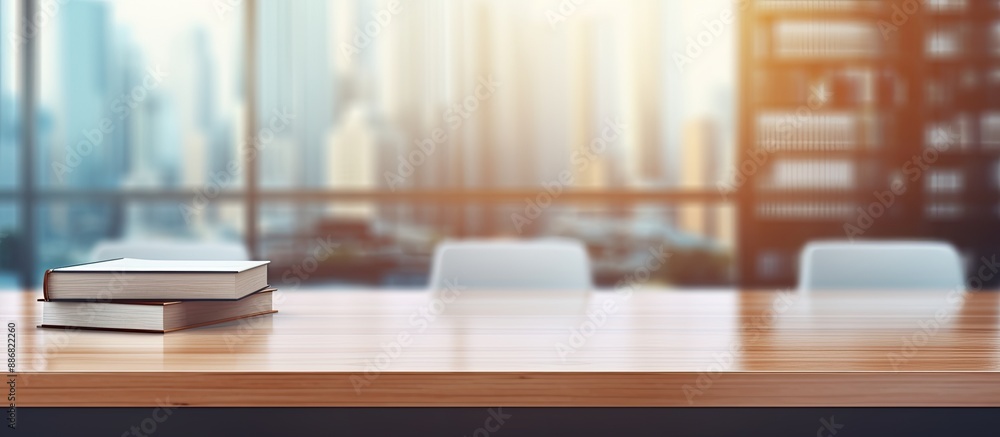 Poster blurry office background with table top featuring copy space image.