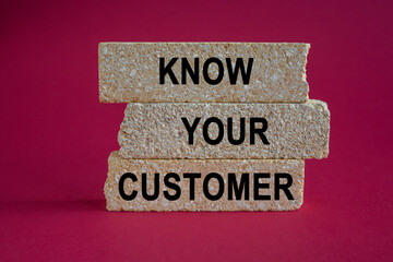Know your customer symbol. Concept words know your customer on brick blocks. Beautiful pink background. Business verifying the identity of its clients concept.