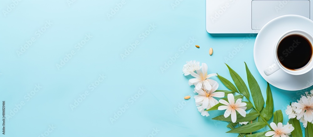 Aufkleber Workspace for bloggers or freelancers featuring a notebook and keyboard on a blue background with copy space image.