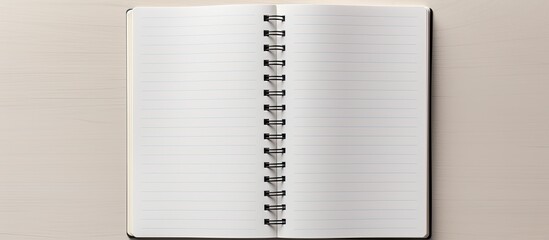 Top view of an open blank notebook on a grey background, ideal as a mockup for design with copy space image.