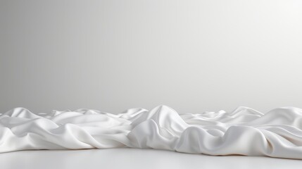  A large, white room featuring a expansive swath of white fabric on the floor, accompanied by a plain white wall in the background