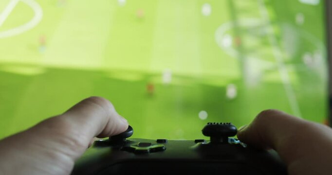 User Playing Soccer Football Video Game On A Game Console 