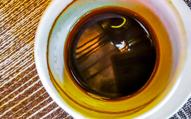 Cup of americano black coffee in restaurant cafe in Mexico.