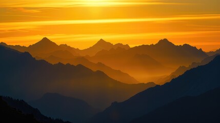 Obraz premium Sunset casting golden hues on mountain silhouettes