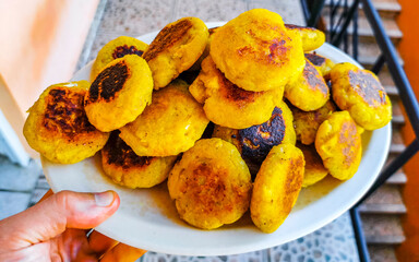 Mexican food with veggie vegetarian banana meatballs dish with cheese.