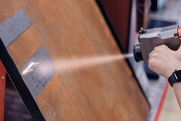 Technology machine laser beam for remove rust from metal. Cleaning iron surface before welding