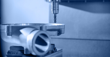 Modern CNC milling machine during operation. Produced cutting metal parts, industry heavy factory