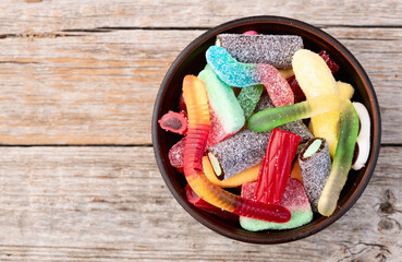 Mix of colorful gummy candies . Sweet dessert