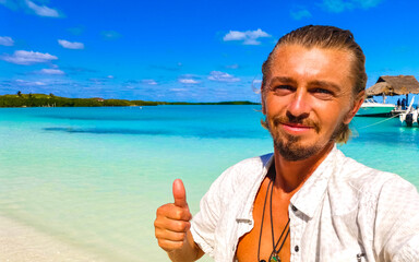 Handsome male tourist tropical natural beach panorama Contoy island Mexico.