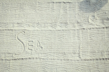 A drawing on the sand by the sea travel background