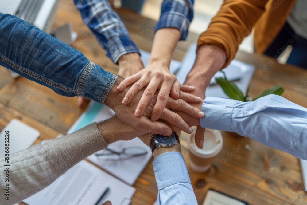 Poster a group of business people with their hands on top, showing unity and support for each other in the 