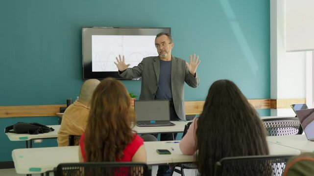 University professor giving a class inside a classroom.