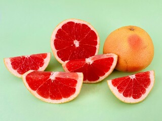 Fresh grapefruit fruit. Grapefruit isolated on green background. Grapefruit with clipping path.