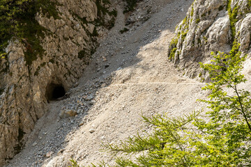 Begunjščica panorama of mountain trekking to the highest peak. View of the Alps, climbing with via ferrata. Distant view of Lake Bled from above. Sports holidays, life of adventure in the countryside.